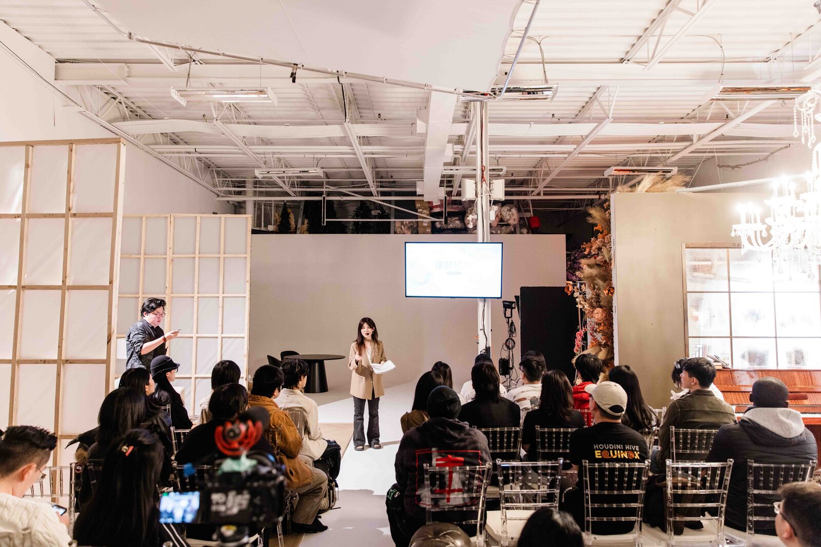 Workshop event — photographer presenting to a group of creatives