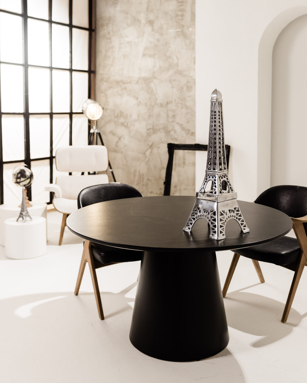 Monochrome Loft — black table with Eiffel tower