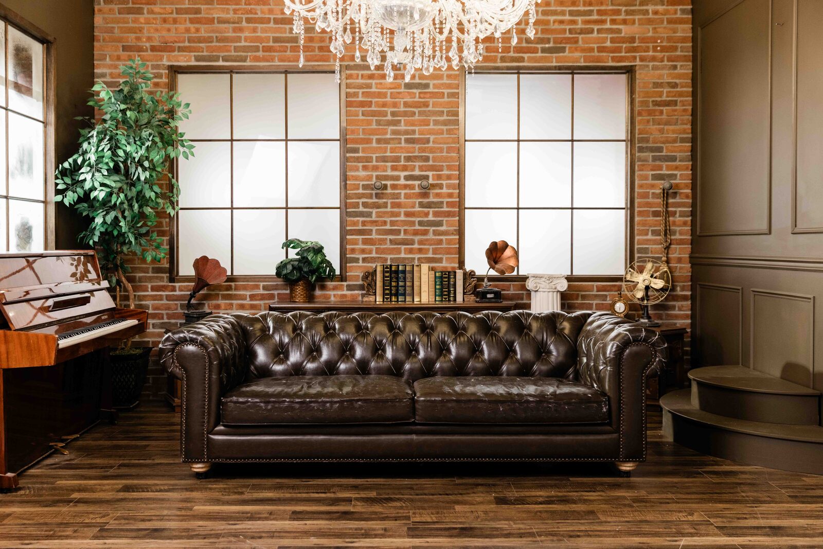 Mozart Studio — brick wall, Chesterfield sofa, piano, vintage decor